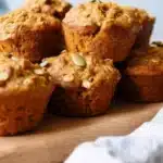 Freshly baked Pumpkin Banana Muffins on a wooden table