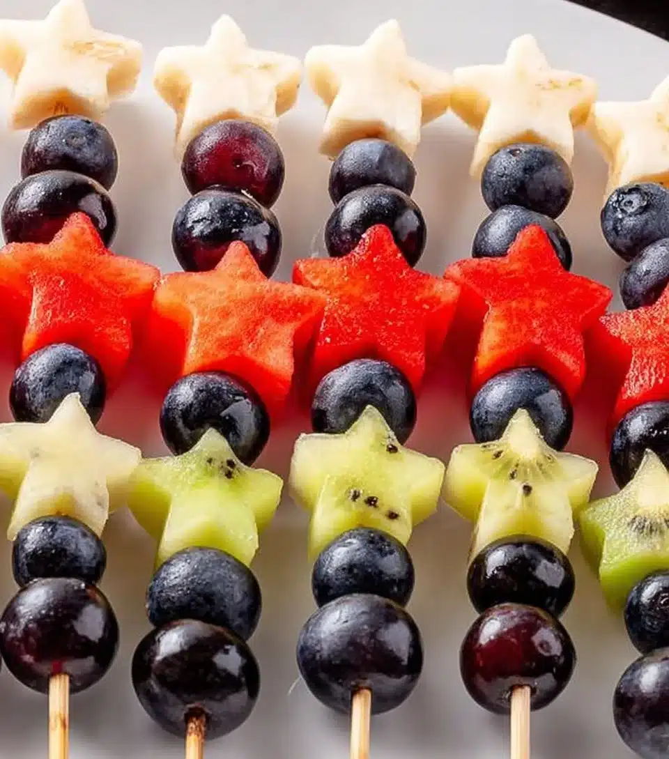 Colorful sparkler fruit skewers with fresh fruits for a vibrant party snack
