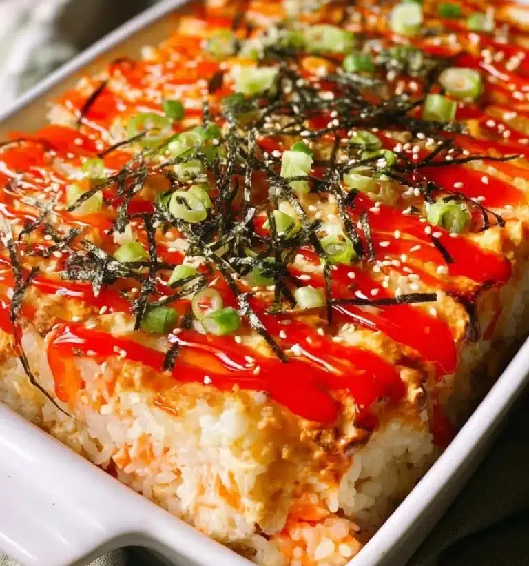 A delectable sushi bake dish with layers of sushi ingredients and toppings.