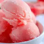 Delicious homemade watermelon sorbet served in a bowl with mint garnish.