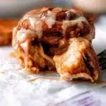 Freshly baked Biscoff cinnamon rolls topped with cream cheese icing