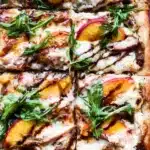 Delicious Chicken Peach Ricotta Pizza topped with fresh ingredients