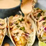Delicious homemade fish tacos with fresh toppings and vibrant colors.