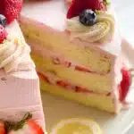 Delicious fruit layer cake with strawberry buttercream frosting and fresh fruits