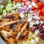 Delicious Greek Chicken Bowl with fresh veggies and zesty dressing