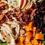 Harvest Cobb Salad featuring butternut squash, fresh greens, and colorful toppings