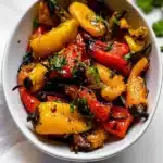 Colorful assortment of mini peppers in a bowl, showcasing their freshness and variety.
