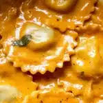 Delicious homemade pumpkin ravioli served with sage butter sauce