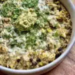 Delicious plate of Salsa Verde Chicken and Rice garnished with fresh herbs
