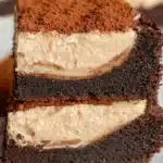 Decadent tiramisu brownies topped with cocoa powder and espresso glaze.