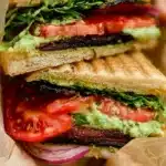 A delicious TLT Sandwich made with tasty ingredients.