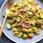 Brussels sprouts mixed with bacon pesto pasta for a flavorful dish