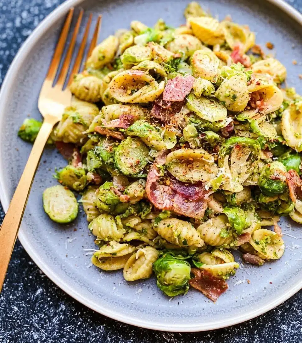 Brussels sprouts mixed with bacon pesto pasta for a flavorful dish
