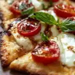 Delicious Caprese Flatbread Pizza with mozzarella, basil, and tomatoes
