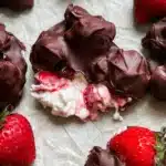 Delicious chocolate covered strawberry yogurt clusters on a plate