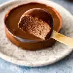 Decadent Chocolate Cremeux dessert topped with chocolate shavings.