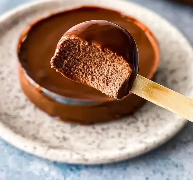Decadent Chocolate Cremeux dessert topped with chocolate shavings.