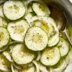 Fresh cucumber vinegar salad in a bowl, perfect for summer meals