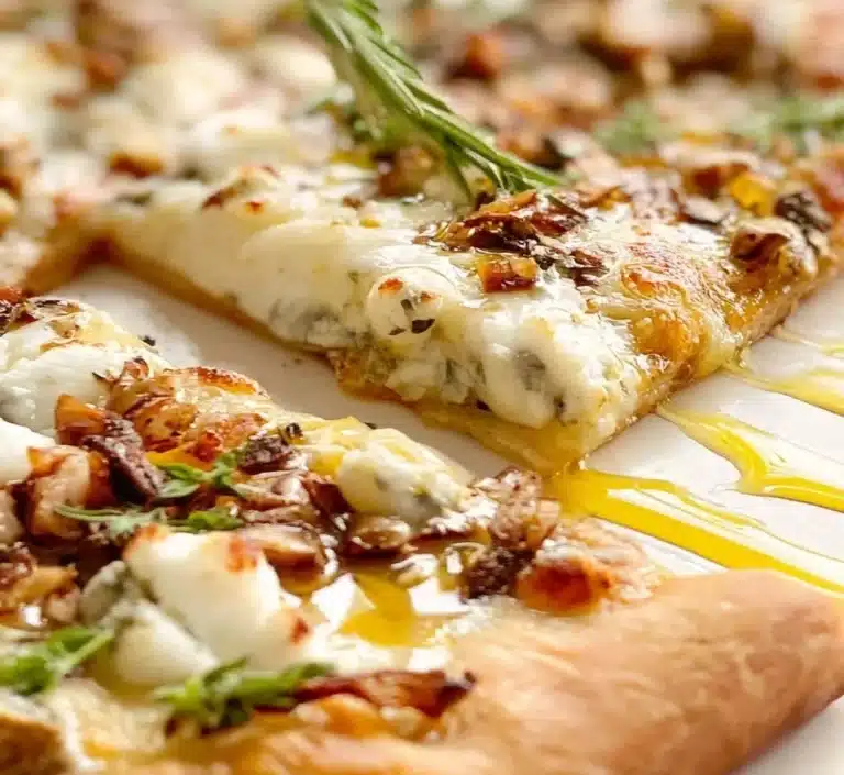 Honey Goat Cheese Pizza with creamy cheese and honey drizzle on fresh crust