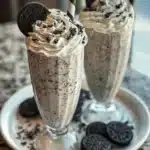 Creamy Oreo Milkshake topped with crushed Oreos and whipped cream