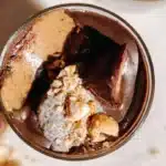 Peanut Butter Cup Chia Pudding with banana and cacao nibs in a bowl
