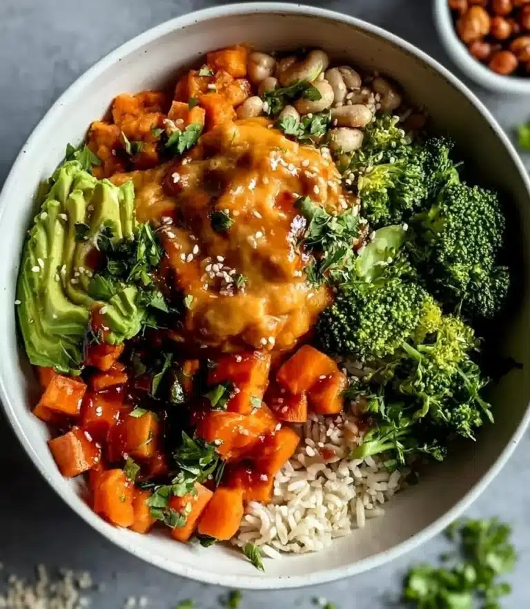 Peanut Sweet Potato Buddha Bowl filled with fresh veggies and peanut sauce