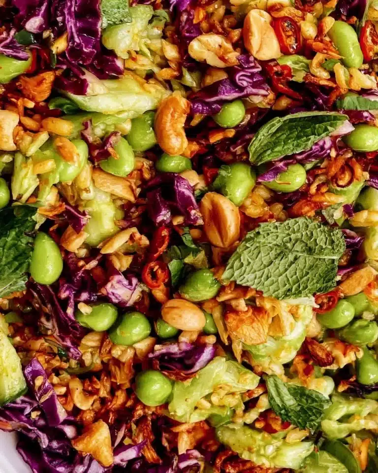 Colorful rice salad with fresh vegetables and herbs in a bowl