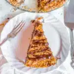 Delicious Samoa Pie with layers of chocolate, coconut, and caramel.