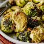 Delicious Tahini Caesar Brussels Sprouts dish garnished with herbs