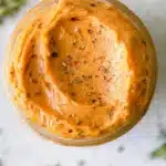 Homemade tomato compound butter served on a slice of bread