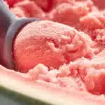 Delicious watermelon ice cream served in a bowl with fresh watermelon slices