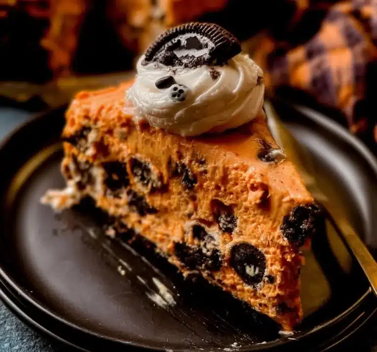 Slice of Cookies And Cream Cheesecake topped with crushed cookies
