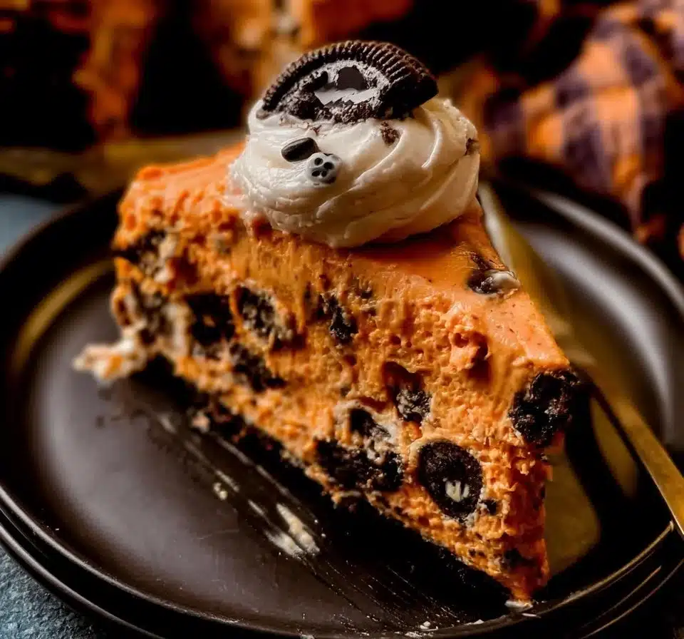 Slice of Cookies And Cream Cheesecake topped with crushed cookies