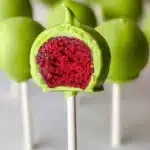 Festive Grinch Cake Pops decorated for holiday celebrations