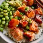 Delicious honey salmon bowl with fresh vegetables and grains