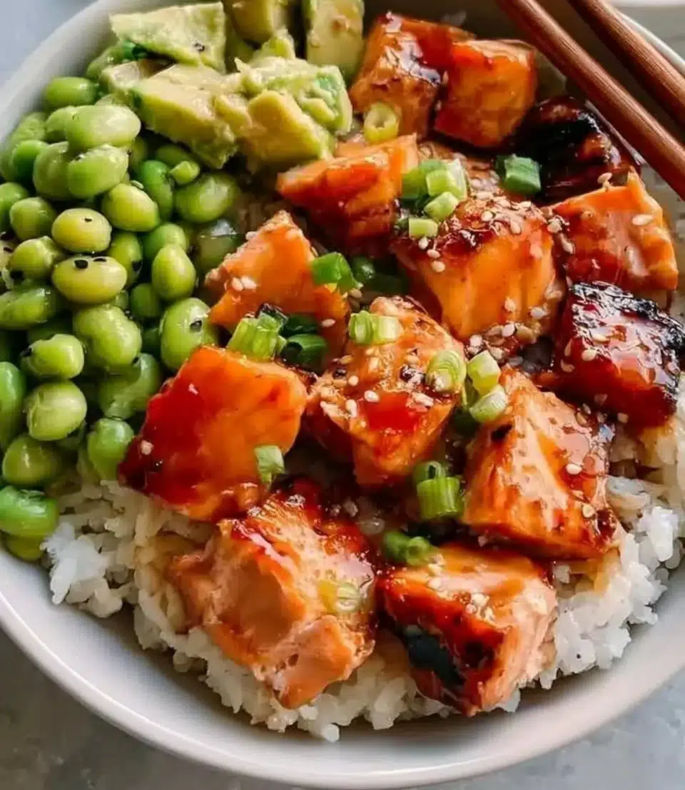 Delicious honey salmon bowl with fresh vegetables and grains