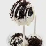 Delicious homemade Oreo Cake Pops decorated with chocolate drizzle