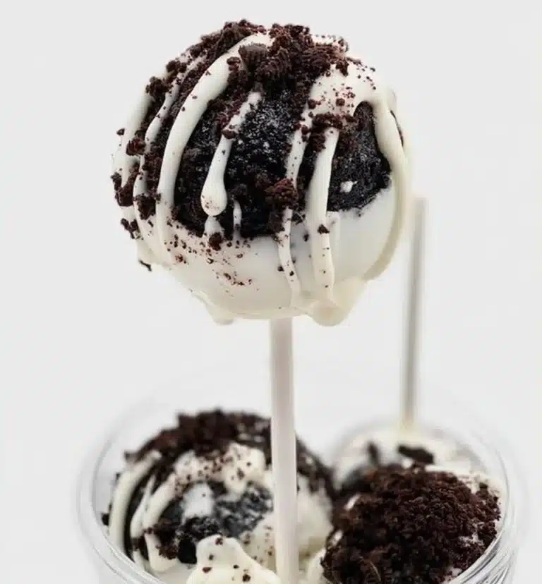 Delicious homemade Oreo Cake Pops decorated with chocolate drizzle