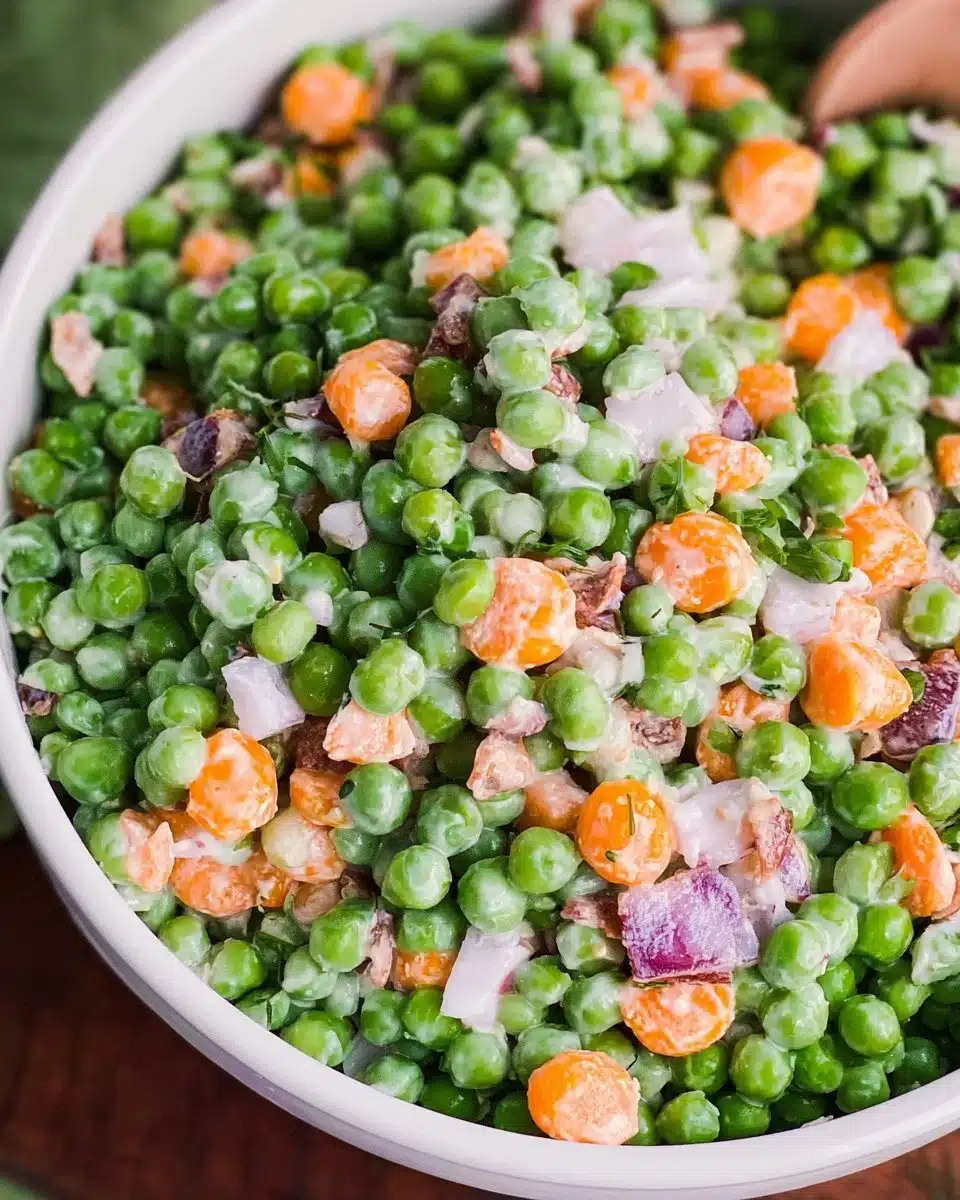Fresh and colorful pea salad with vegetables and dressing.
