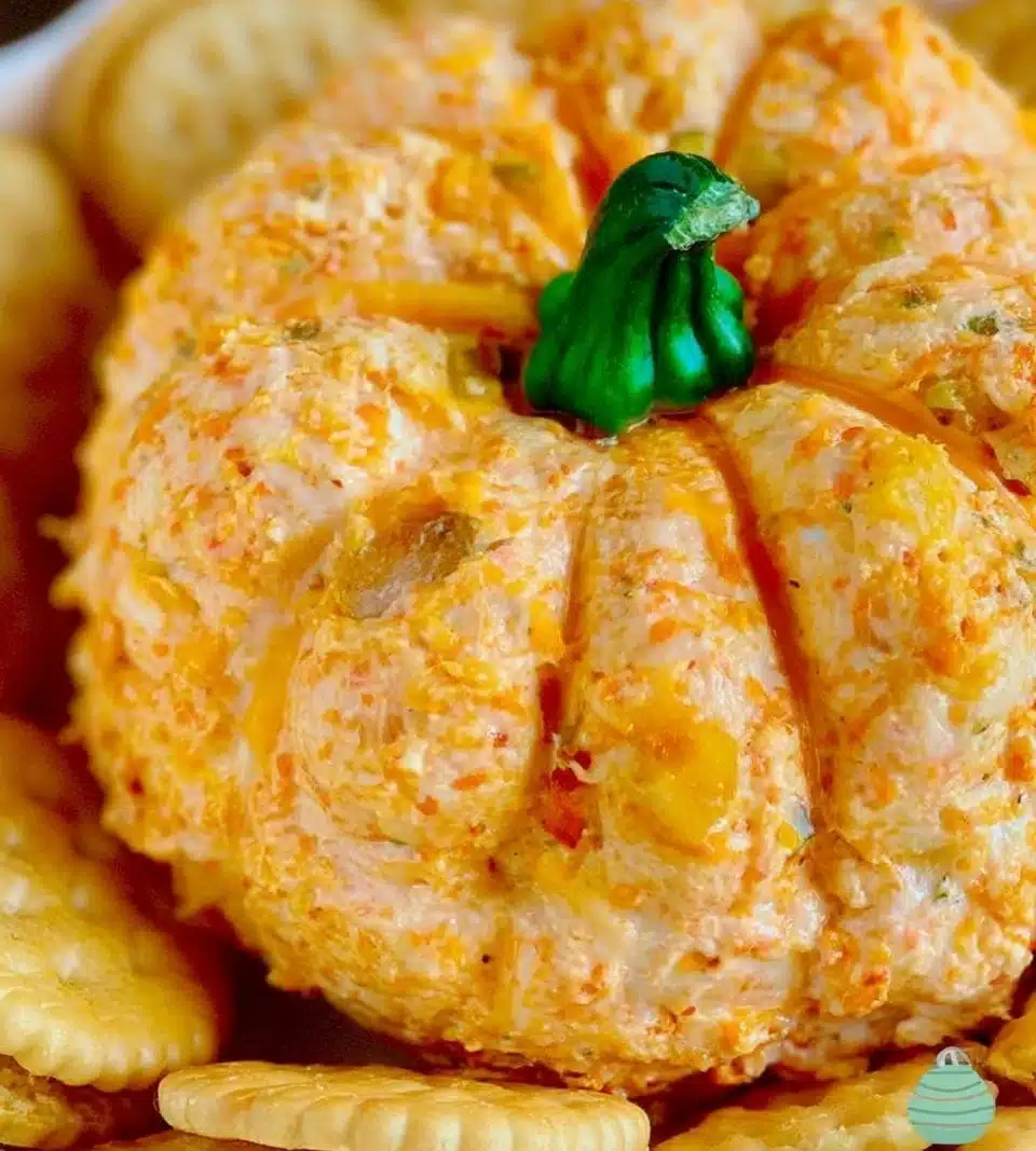 Pumpkin-shaped cheeseball served as a fun autumn appetizer