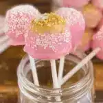 Colorful Starbucks cake pops displayed on a decorative plate.