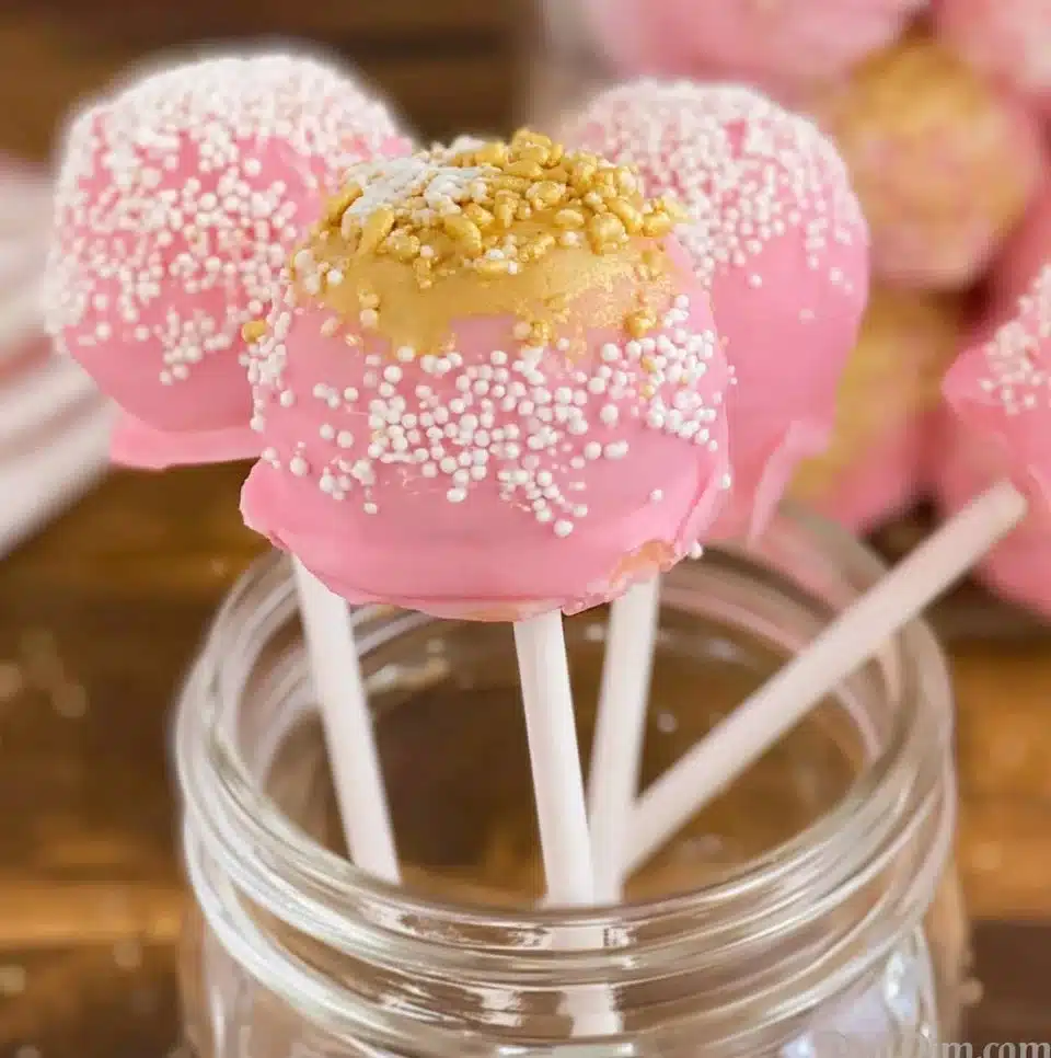 Colorful Starbucks cake pops displayed on a decorative plate.