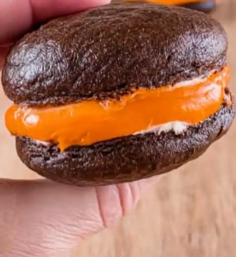 Delicious whoopie pies filled with creamy frosting between chocolate cakes.