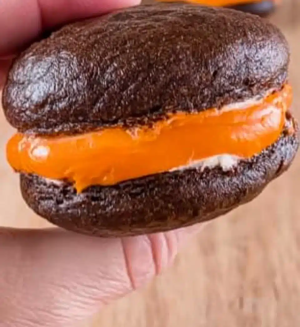 Delicious whoopie pies filled with creamy frosting between chocolate cakes.