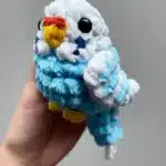 Colorful pocket parrots perched on a hand, showcasing their miniature size.